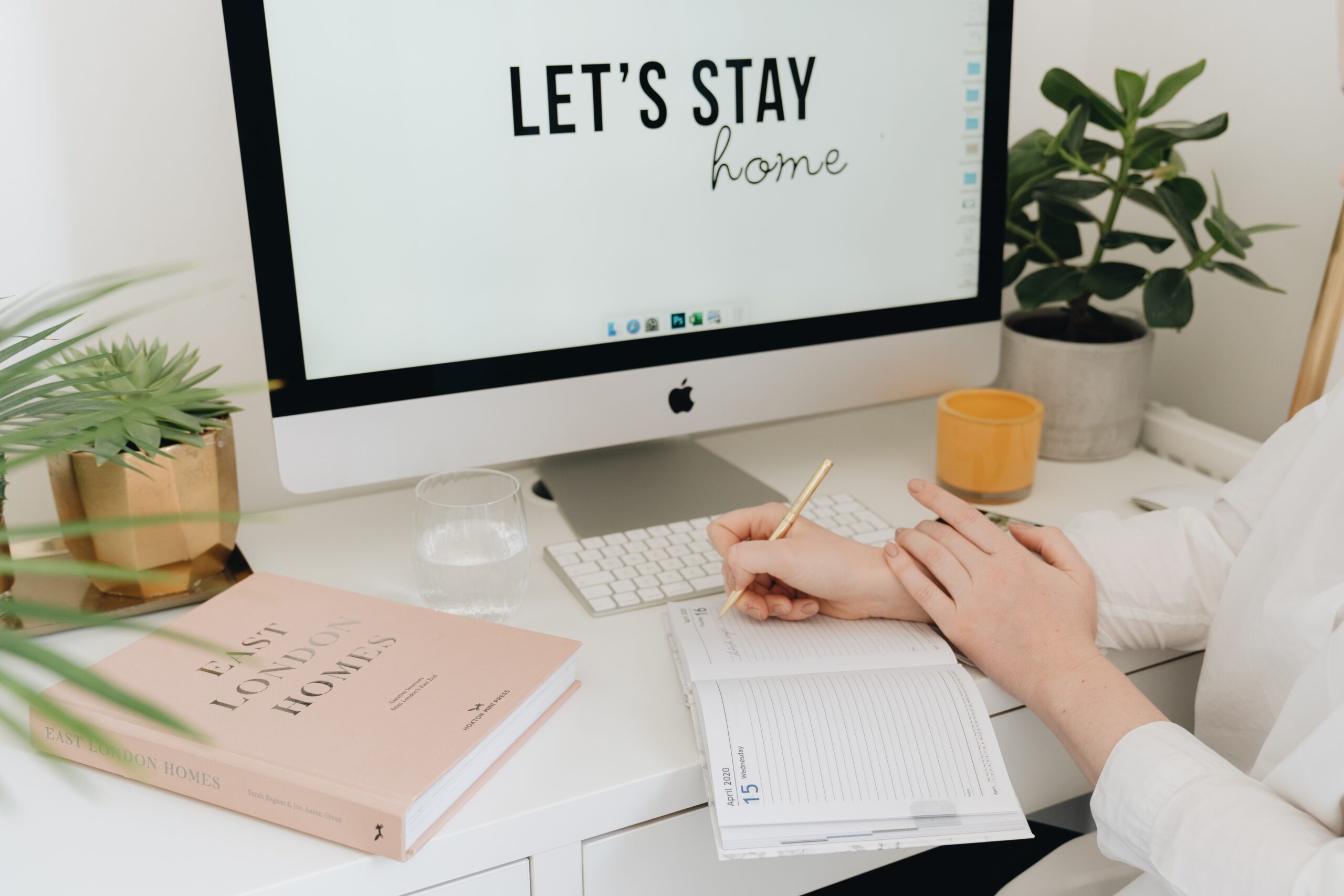 10 tips for designing a website that converts visitors into customers - laptop on desk with website design on screen